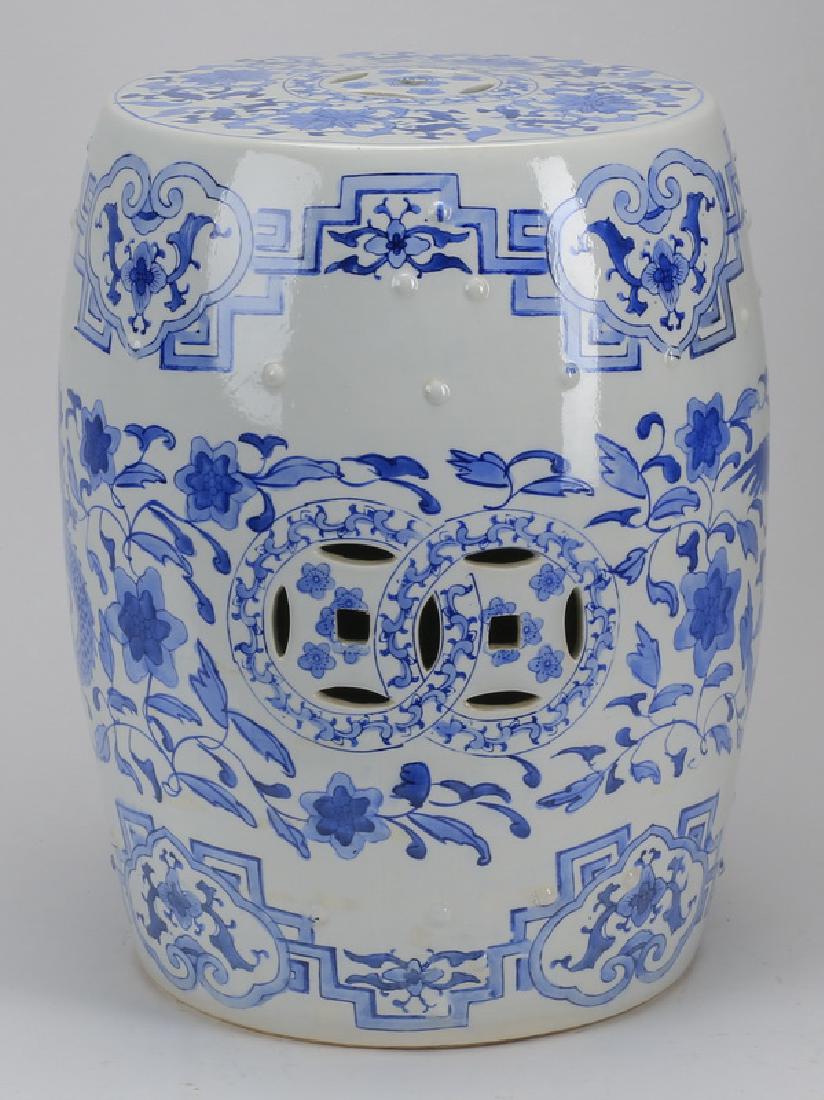 Chinese porcelain garden seat, 18"h: Blue and white Chinese porcelain garden seat, with allover foliate decoration, 18"h x 12"w.