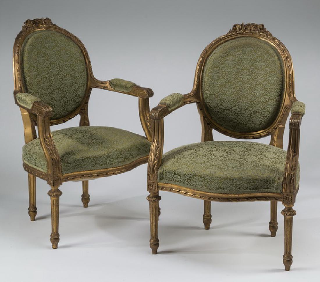 (2) Early 20th c. Louis XVI style gilt wood fauteuils (1 of 2)