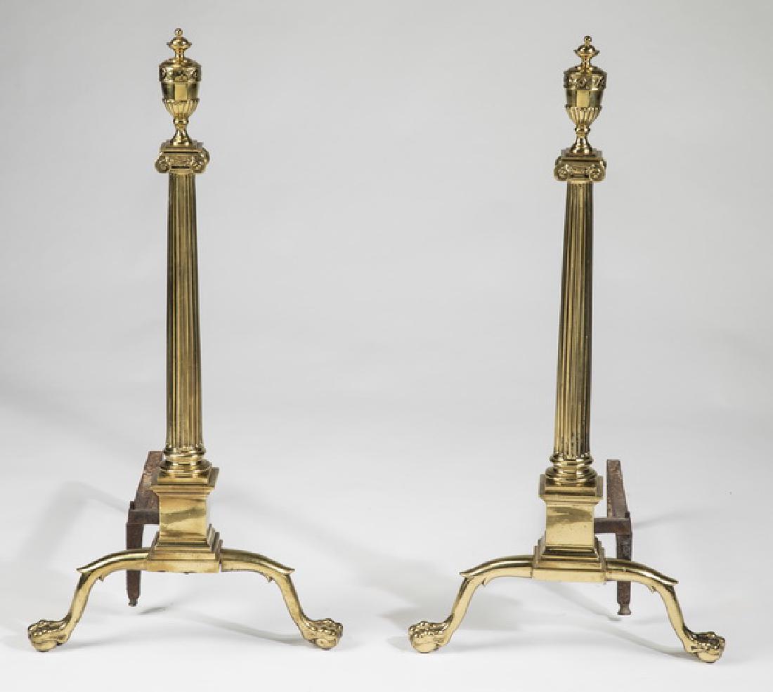 Brass andirons in the Adams taste, 30"h: Brass andirons in the Adams taste, having baluster form finials above Ionic capitals, surmounting tapering reeded columnar standards, each resting on a square shaped plinth and ending in cabriole legs