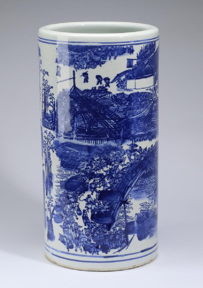 Chinese transferware umbrella stand, 17"h: Chinese blue and white transferware umbrella stand, of cylinder form decorated with urban and rural landscapes, the underside with a blue four character mark, 17"h x 8.5"w.
