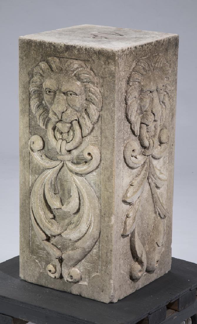 Carved Italian limestone pedestal: Relief carved Italian limestone pedestal, having lion masks with rings issuing acanthus swags on two sides, 25.5"h x 11.5"sq.