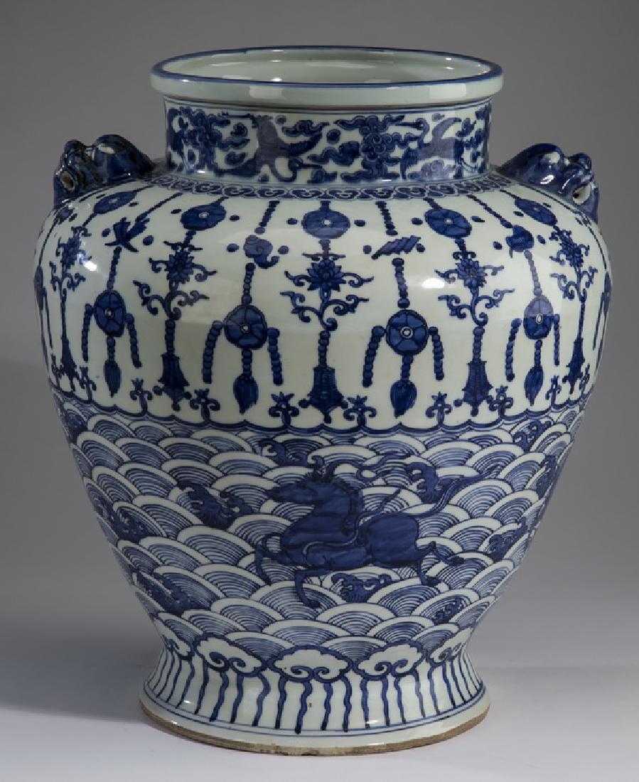Ming style Chinese jar w/ horses & Buddhist symbols: Ming style Chinese blue and white jar, having a flattened rim above a short cylindical neck decorated with cranes and auspicious cloud forms surmounting the shouldered form, having a ruyi band above a