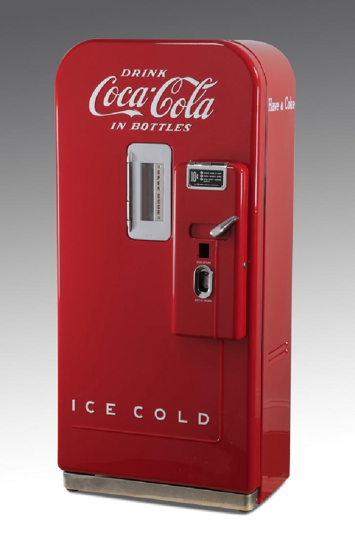 Circa 1948 Vendo Coca-Cola machine, 58"h: Vintage Coca-Cola machine, 1948-1957, a Vendo Model 39 mechanical single drink dispenser with a restored case, offering 8 oz. bottles for 10 cents, holds 39 bottles, 58"h x 27"w x 20.5"d.