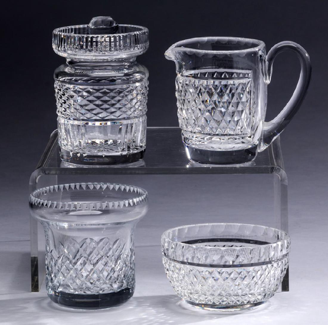 (4) Crystal table accessories including Waterford: Waterford crystal table accessories in the 'Alana' pattern, comprising: (1) jam pot; (1) creamer; and (1) sugar, each piece with a honeycomb etched pattern, marked Waterford underneath; together with