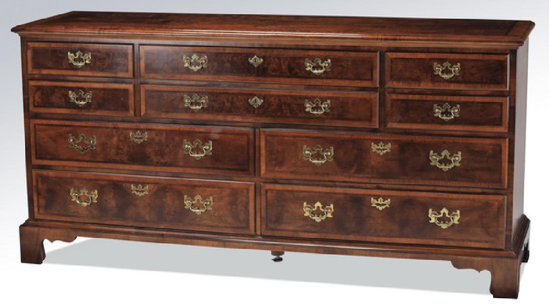 Henredon Furniture Federal style mahogany chest: Henredon Furniture burl and mahogany chest in the Federal taste, having a rectangular top surmounting two long drawers flanked by two short drawers, above four drawers, all with bat wing brasses, the 
