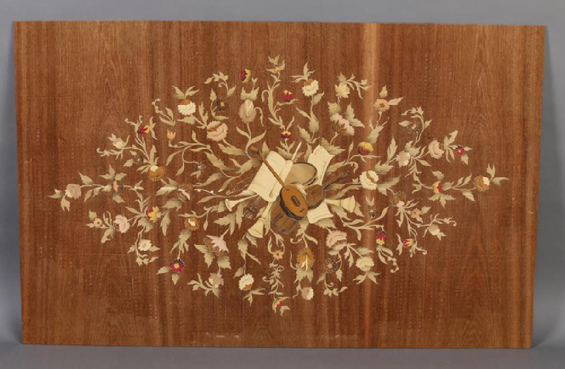 Italian marquetry inlaid panel w/ musical trophy: Italian polychrome marquetry inlaid panel, depicting a musical trophy surrounded by a floral lozenge, unvarnished and laid on board, 26.75"h x 43.25"w.
