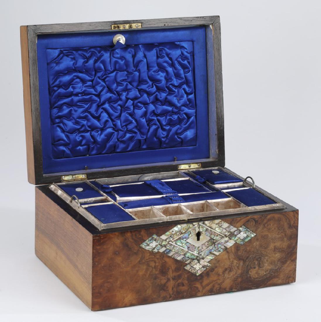 19th c. burl veneered gentleman's travel case: 19th century burl veneered gentleman's travel case, the lid centering abalone diamond-shaped inlay, opening to reveal a fitted removeable tray with individual lids, the front with similar inlay center