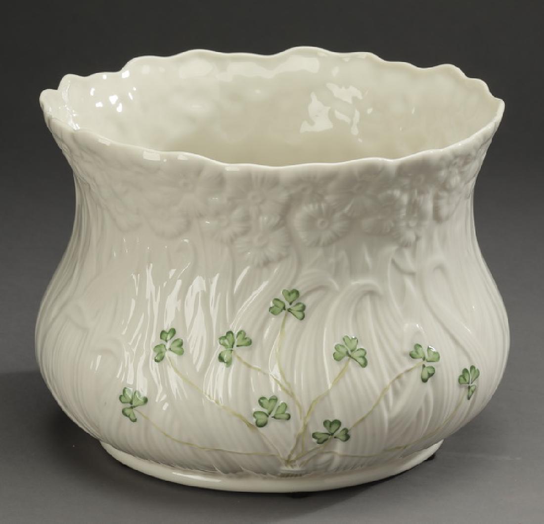 Belleek porcelain 'Daisy' planter, 7"dia: Belleek porcelain planter in the 'Daisy pattern, having a fluted scalloped edge with continuous blooming daisies around the bowl with hand painted shamrock accents, marked, 5.5"h x 7.25"dia.