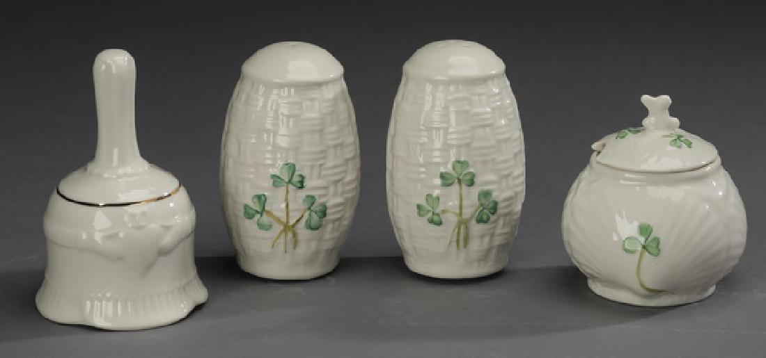4 Pc. Belleek porcelain table accessories: Belleek porcelain table accessories, comprising: (1) pair of salt and pepper shakers in the 'Shamrock' pattern, each having a woven texture accented with hand painted shamrocks, marked, 3.5"h; (1) mus