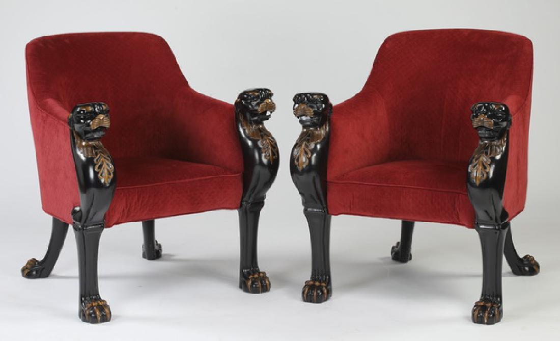 (2) Baker Furniture figural ebonized bergeres: Pair of Baker Furniture ebonized bergeres in the Egyptian Revival taste, having squared backs and continuous arms ending in figural stiles in the form of panther monopodials with giltl highlights risi