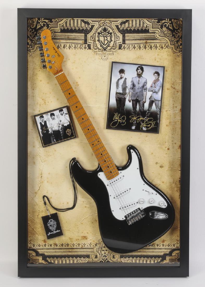 Signed Jonas Brothers photos w/ stratocaster, framed (1 of 2)