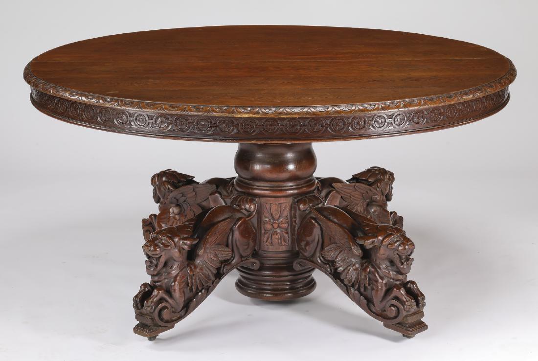 19th c. French oak center table w/ carved grotesques (1 of 3)