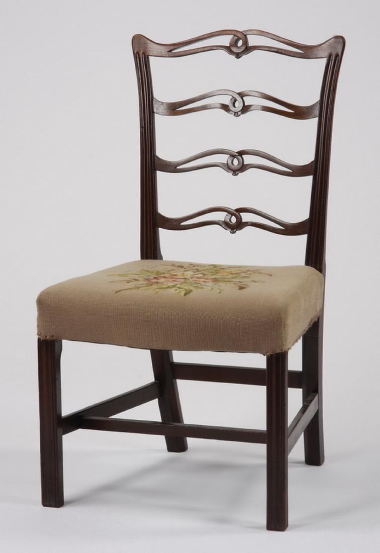 Early 20th c. needlepoint upholstered chair: Early 20th century American pierce carved ladder back mahogany side chair with needlepoint upholstered seat, 38.5"h x 22"w x 21"d.