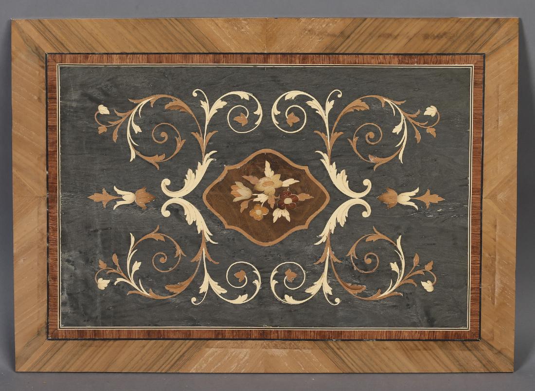 Renaissance style Italian marquetry inlaid panel: Italian polychrome marquetry inlaid panel in the Renaissance taste, centering a floral cartouche flanked by acanthus scrollwork on a gunmetal ground, framed in chevron inlay, unvarnished and laid on b