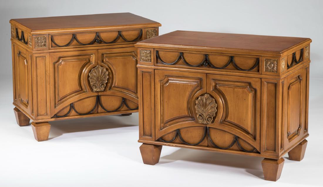 (2) Phyllis Morris contemporary side tables: Pair of contemporary Phyllis Morris side tables, 20th century, both having rectangular tops above central drawers decorated with iron swags flanked by carved rosettes, surmounting hinged cabinet doors