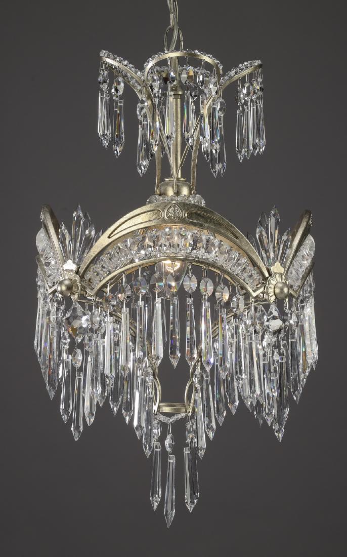 Schonbek crystal Art Deco style pendant light, 32"h: Schonbek crystal Art Deco style pendant light, having a scalloped crown hung throughout with crystal strands ending in crystal pendants, above the central light supporting the scalloped waist with cry