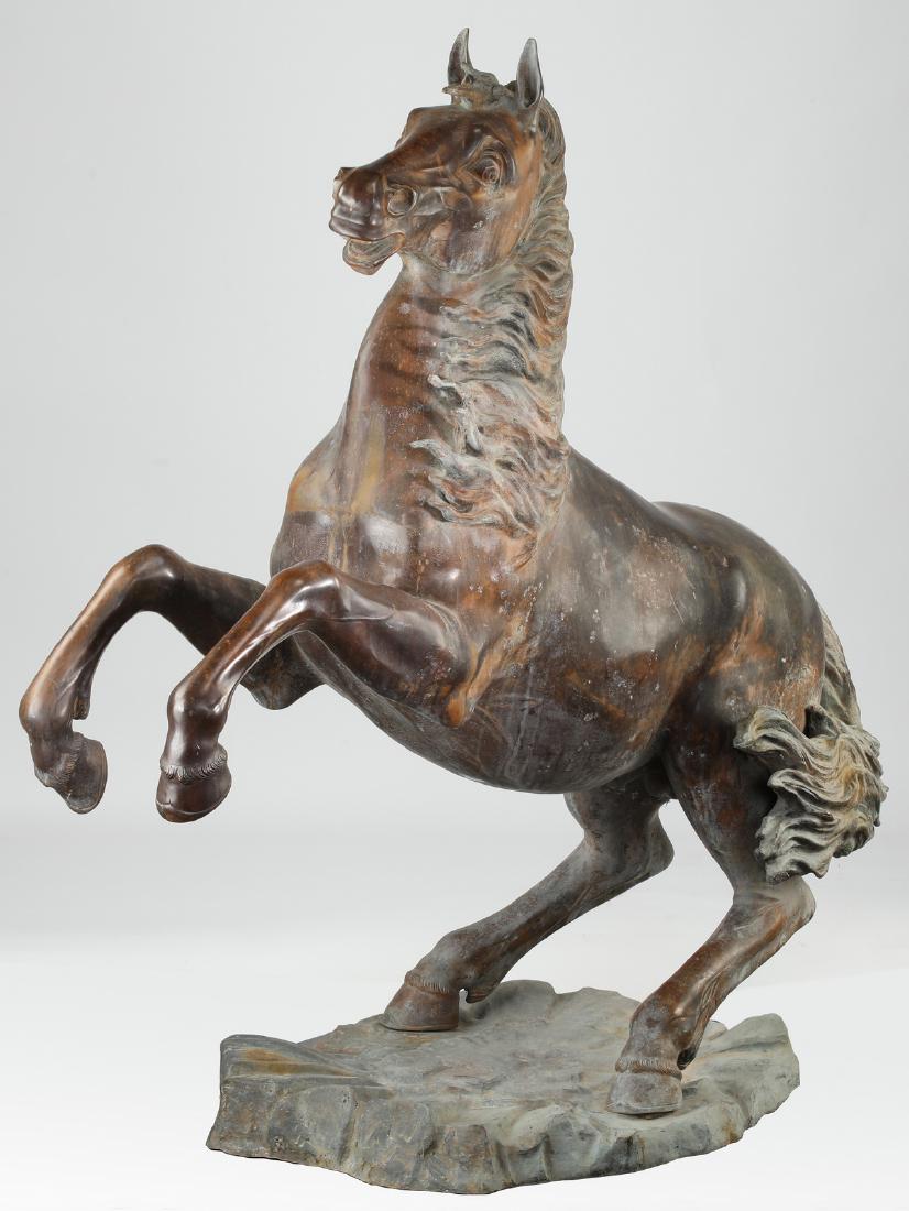 Italian cast bronze horse sculpture, marked, 48"h: Italian cast bronze horse sculpture, depicting a rearing horse resting on a shaped plinth, foundry marked 'Fonderia Artistica Ruocco Napoli', 48"h x 13.5"w x 42"l.