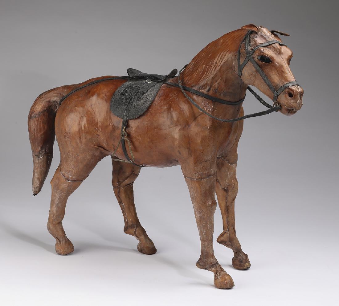 Hand crafted leather figure of saddled horse (1 of 2)