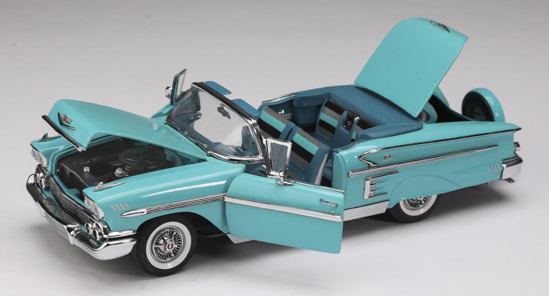 Danbury Mint 1958 teal Chevrolet Impala, 3"h: Danbury Mint 1958 teal Chevrolet Impala, die-cast at 1:24 scale, marked, 2.5"h x 3"w x 9"d.
