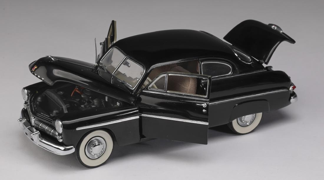 Danbury Mint 1949 black Mercury Club Coupe, 3"h: Danbury Mint 1949 black Mercury Club Coupe, die-cast at 1:24 scale, marked, 2.75"h x 3"w x 8.25"d.