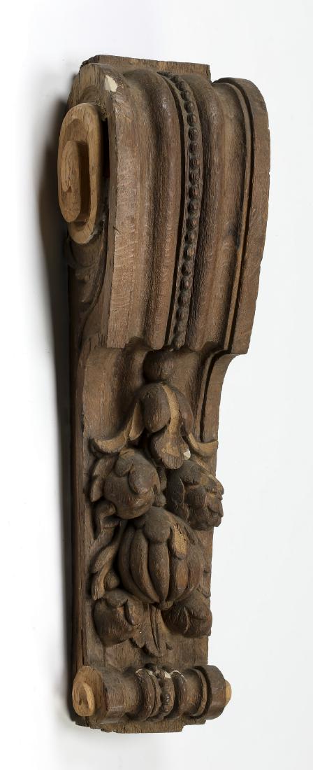 19th c. carved corbel, 26"h: 19th century Continental carved corbel having a beaded and fluted scrolling top, surmounting relief carved fruits, and terminating to a scroll, 26"h x 8"w x 5"d.