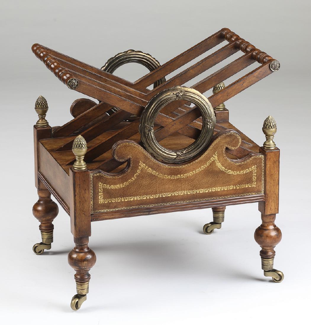 Regency style canterbury on casters: Regency style canterbury, having two gilt wreath supports, flanking crossed dividers joined with turnings and accented with rosettes, above an undulating faux leather frieze with a gilt border, flanke