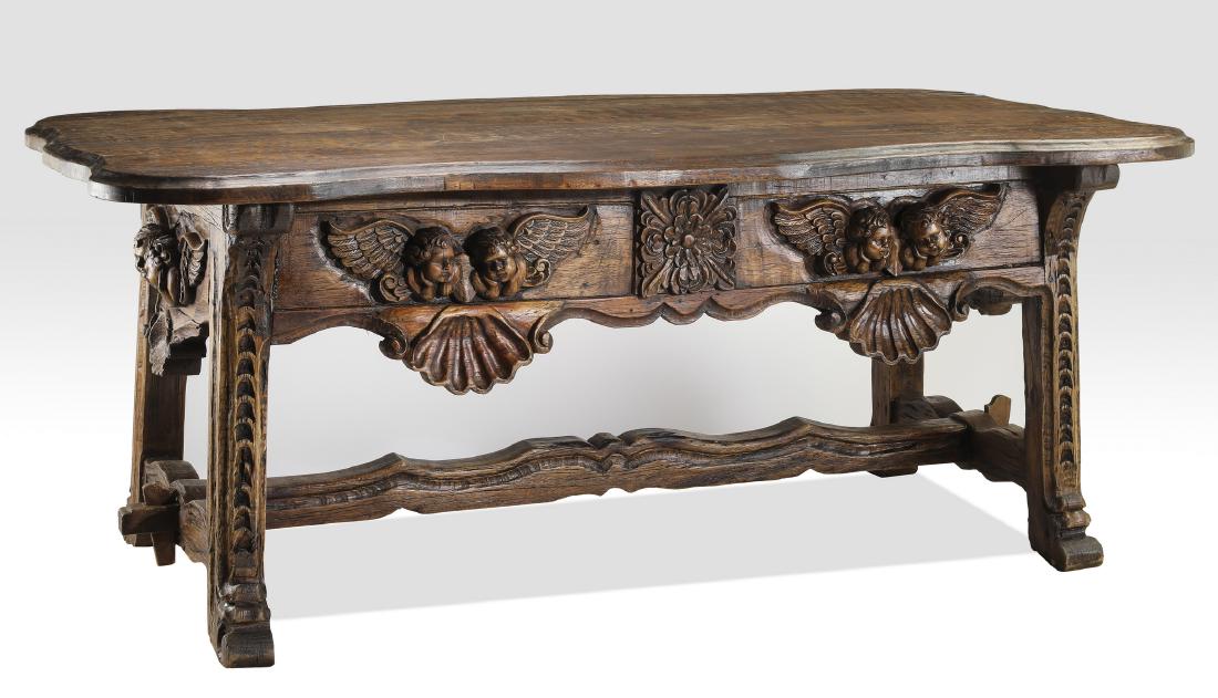 19th c. Continental rustic oak carved table: 19th century Continental Renaissance style rustic carved oak table, having a shaped surface above the apron carved with two pairs of putti and scalloped shells, centering a foliate cartouche, resting 