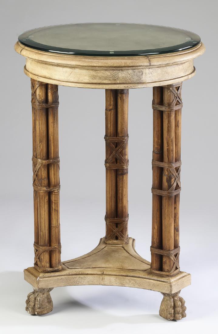 Empire style faux bamboo & glass side table: Empire style side table, having a circular beveled glass top, above a wide apron rising on three faux bamboo form legs, resting on a tripartite base, and terminating in paw feet, 29"h x 20"dia.