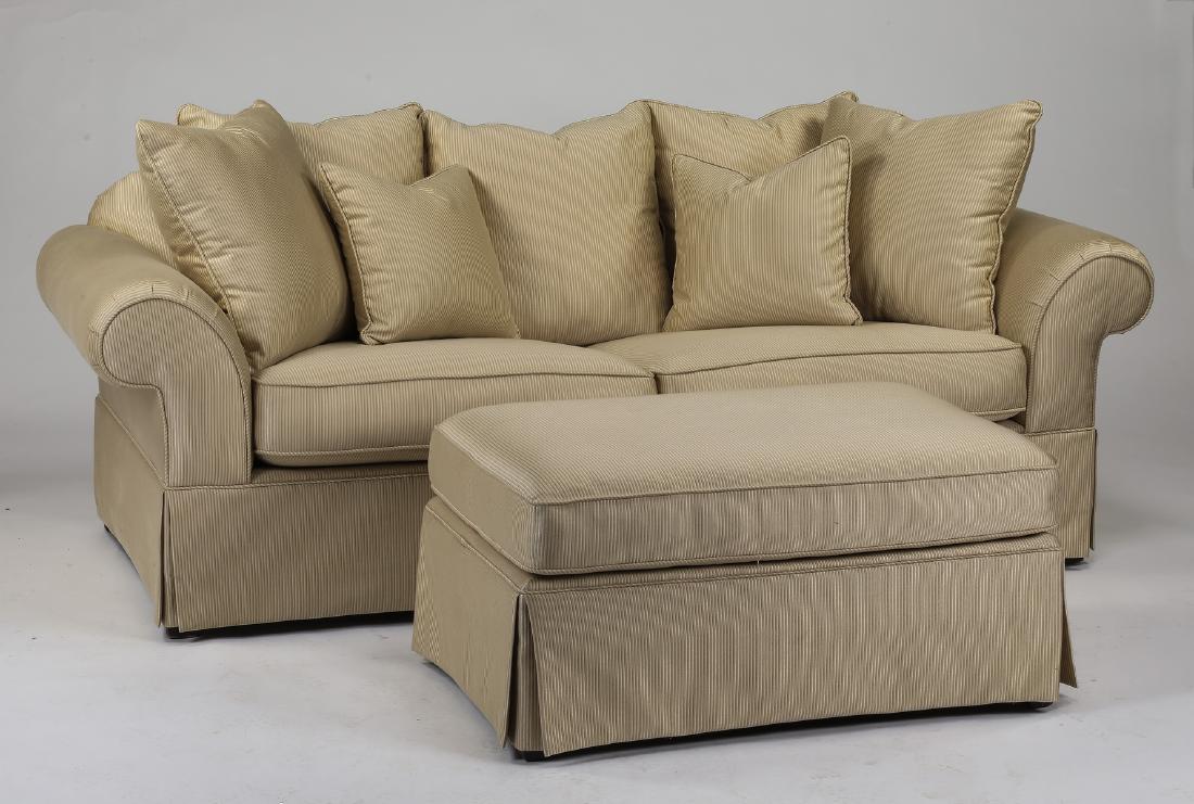 Contemporary sleeper sofa with matching ottoman: Sleeper sofa with matching ottoman, having a scatter back and drop-in seat cushions in striped cream upholstery, concealing the fold out mattress, all resting on a fully skirted base, 32"h x 86"w x 40