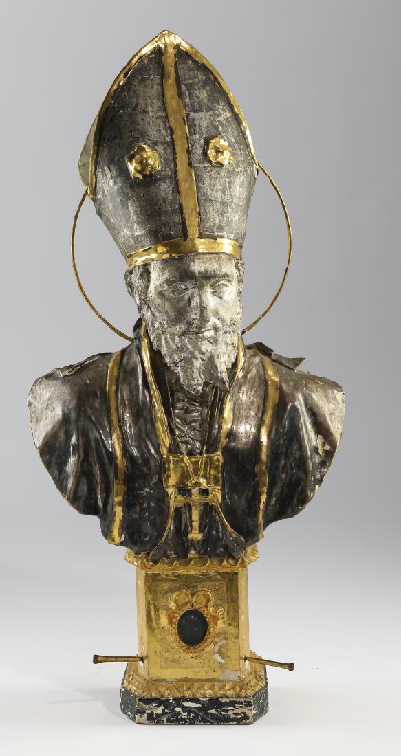 19th c. silver gilt papier mache bust of St. Peter: Silver gilt papier mache bust of Saint Peter, late 19th or early 20th century, the saint depicted with a halo behind a bishop's mitre above robes and a cross, the whole resting on a reliquary base, 44