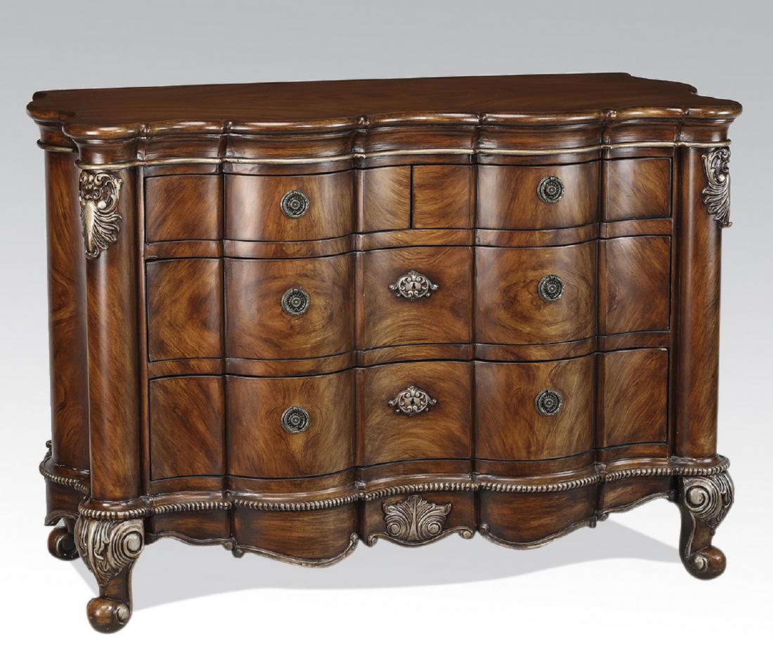 Carved and silver-decorated Louis XIV style commode: Louis XIV style commode, having a scalloped surface over two conforming short drawers and two conforming long drawers, flanked by columnar stiles with silver-decorated acanthus, resting on a shaped ap