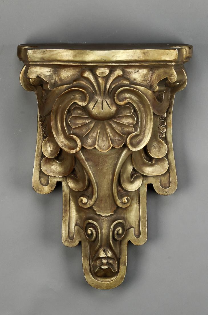 Gilded Louis XV style ceramic wall bracket, 19"h: Gilded Louis XV style ceramic wall bracket, having a shaped serpentine top, above a scalloped scrollwork motif support, 19"h x 13"w x 6.5"d.