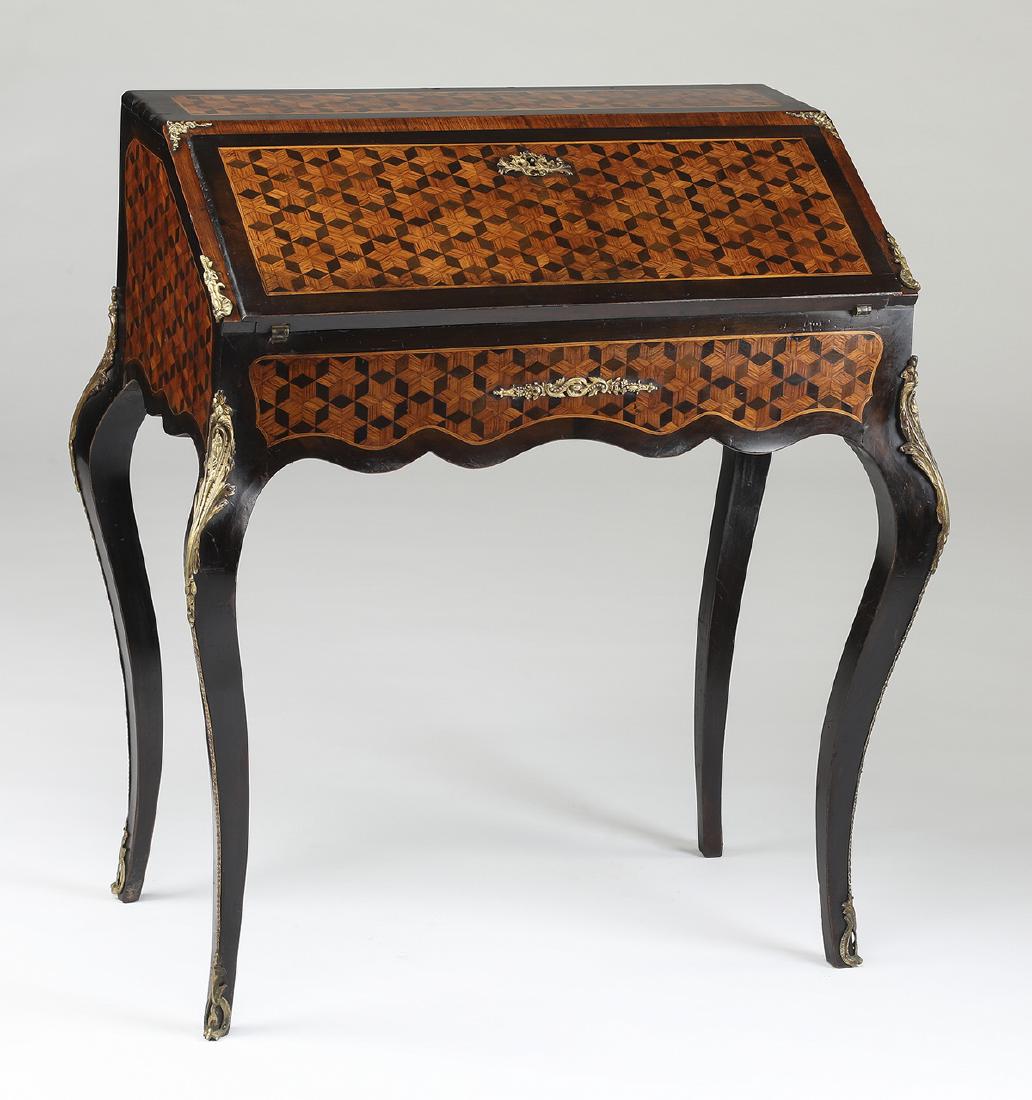 Early 20th c. French parquetry linlaid writing desk: Ebonized and parquetry inlaid writing desk in the Louis XV style, early 20th century, having a fall-front of exotic wood parquetry with ebonized borders, opening to a fitted interior having an inset l