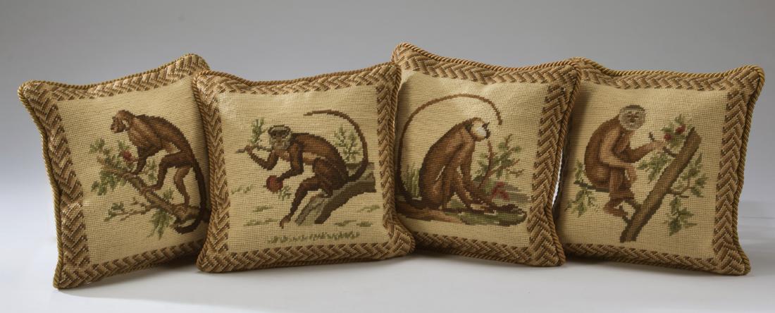 (4) Needlepoint monkey pillows, 11" square: Set of four needlepoint pillows, each having a monkey motif bordered by a herringbone band, the zippered back being beige velvet, each 11.25"sq.