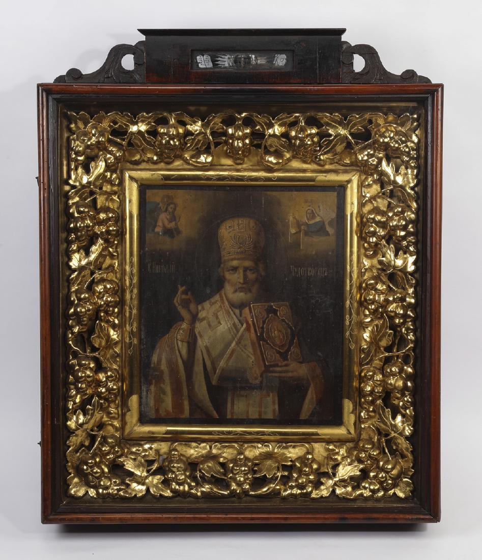 19th c. Russian Orthodox icon of St. Nicolas: Russian Orthodox icon, 19th century, executed in oil on panel, depicting a bearded St. Nicholas wearing a mitre and holding a book with an exordium hand gesture, flanked in the upper corners by Christ