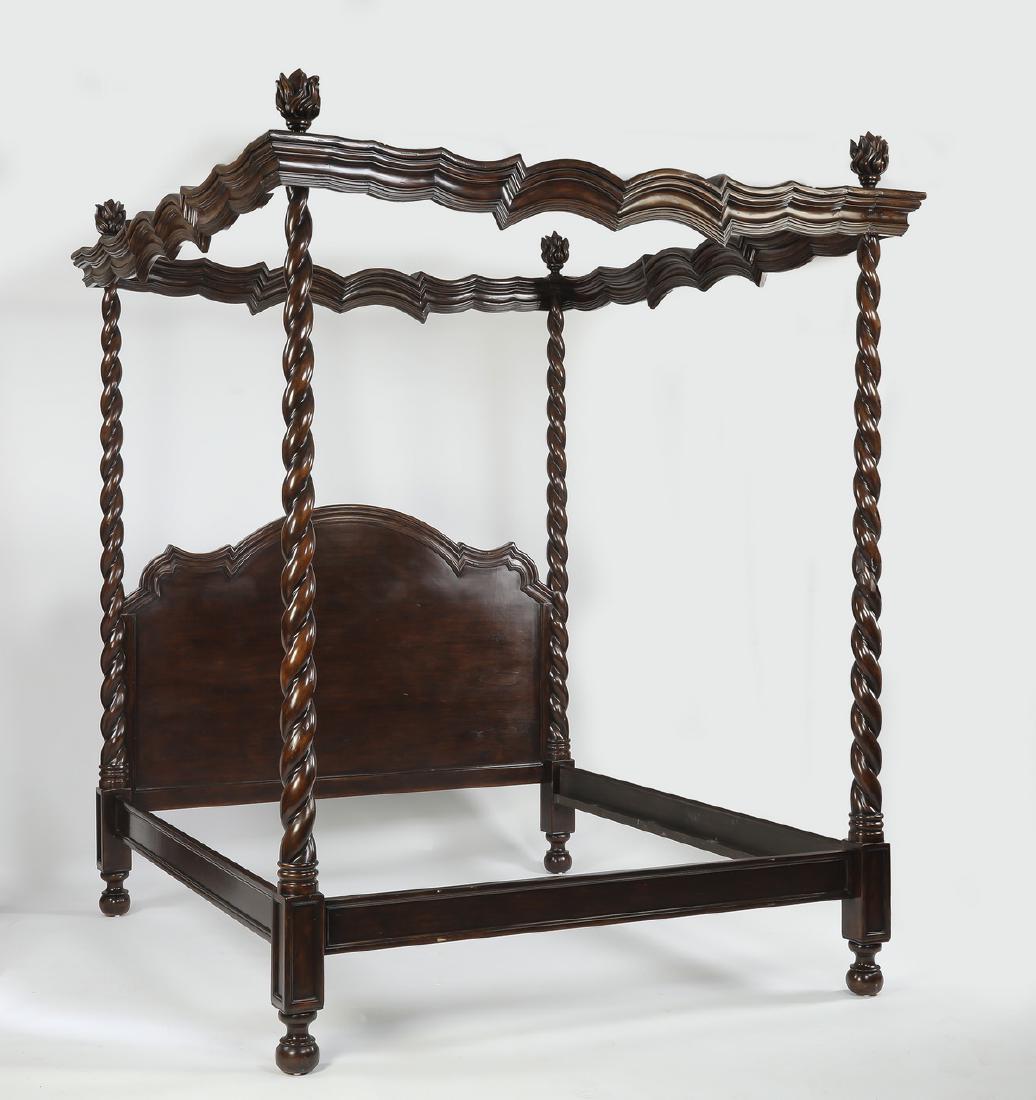 Carved mahogany king canopy bed, 108"h: Carved mahogany king canopy bed, having a shaped canopy with torch finials, above four twist turned posts centering the undulating headboard, all resting on bun feet, interior dimensions 75"w x 81"d;
