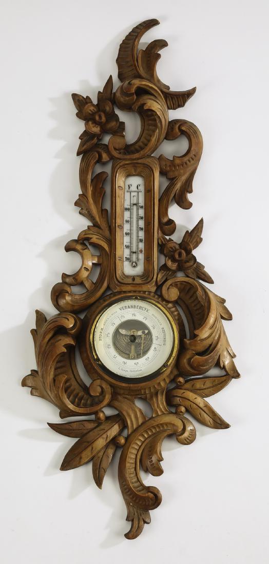 Early 20th c. Dutch carved Rococo style barometer: Late 19th or early 20th century Dutch carved oak barometer in the Rococo taste, the mechanisms within an elaborate C-scroll cframe interspaced with acanthus, the dial face marked 'Veranderlijk / C. Ko
