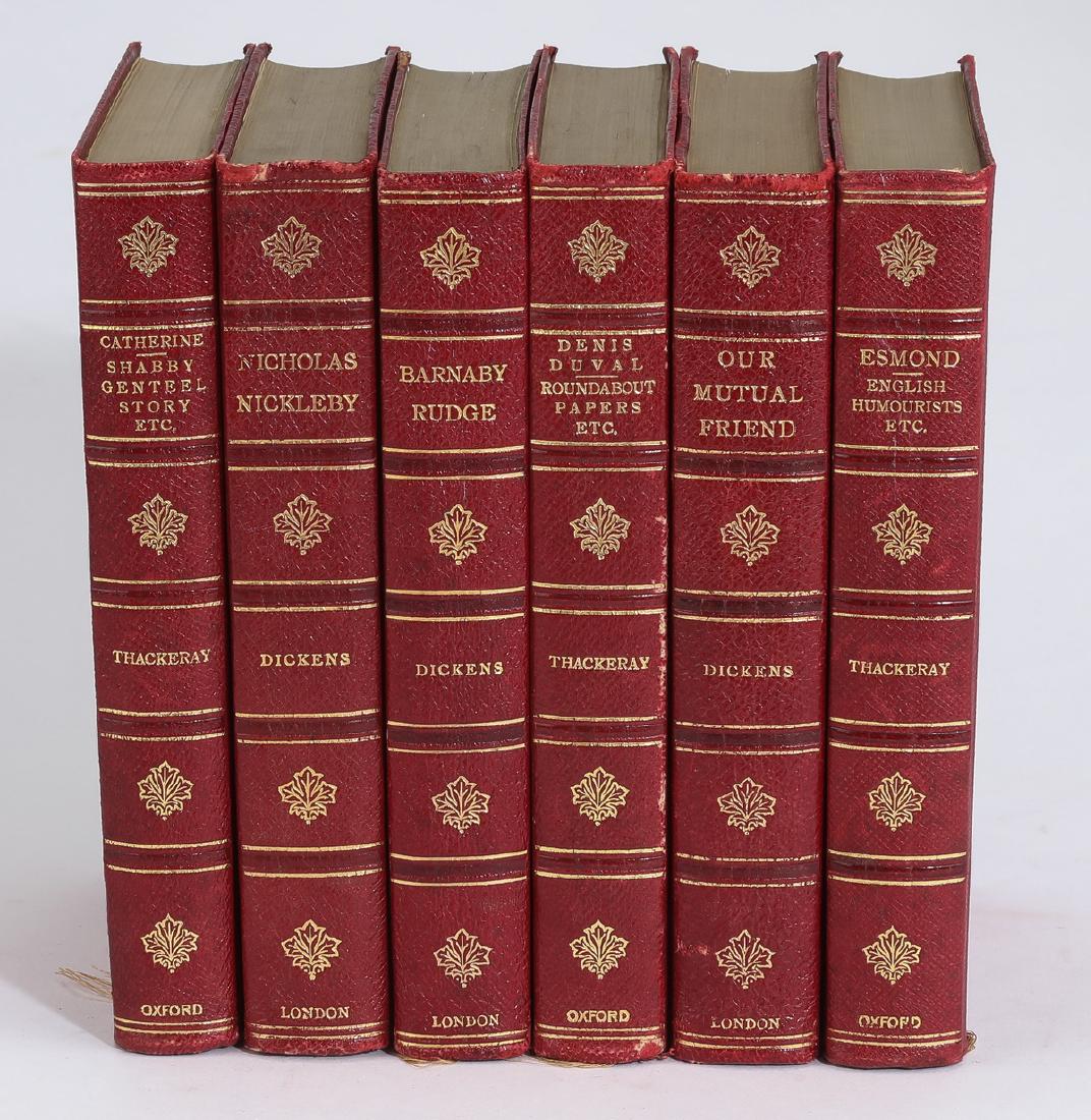 (6) Leather bound volumes by Dickens & Thackeray: Red leather bound volumes by Charles Dickens and William Thackeray, comprising Nicholas Nickleby, Barnaby Ruge, and Our Mutual Friend by Dickens, together with Catherine, Denis Duval, and Esmond by Th