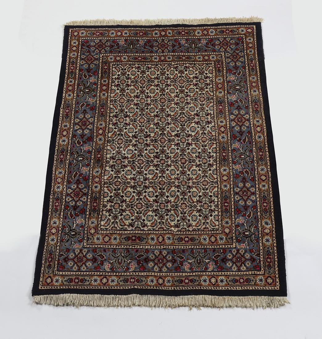 Persian hand knotted wool carpet, 5 x 3: Persian hand knotted wool carpet, having an all over Herati design on a cream ground with an alternating rosette border on a slate blue ground, 5"l x 3' 4"w.