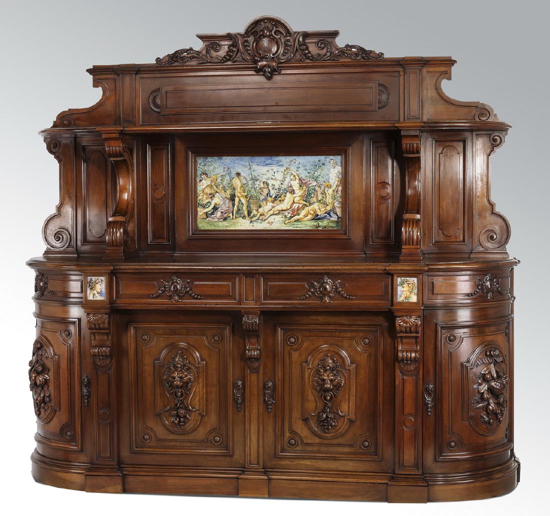 19th c. French buffet w/ bacchanalia majolica plaques: French Renaissance Revival walnut huntboard with majolica embellishment, late 19th century, having a crest centering a monogrammed cabochon flanked by bellflower drops and foliate scrolls, over a D-sh