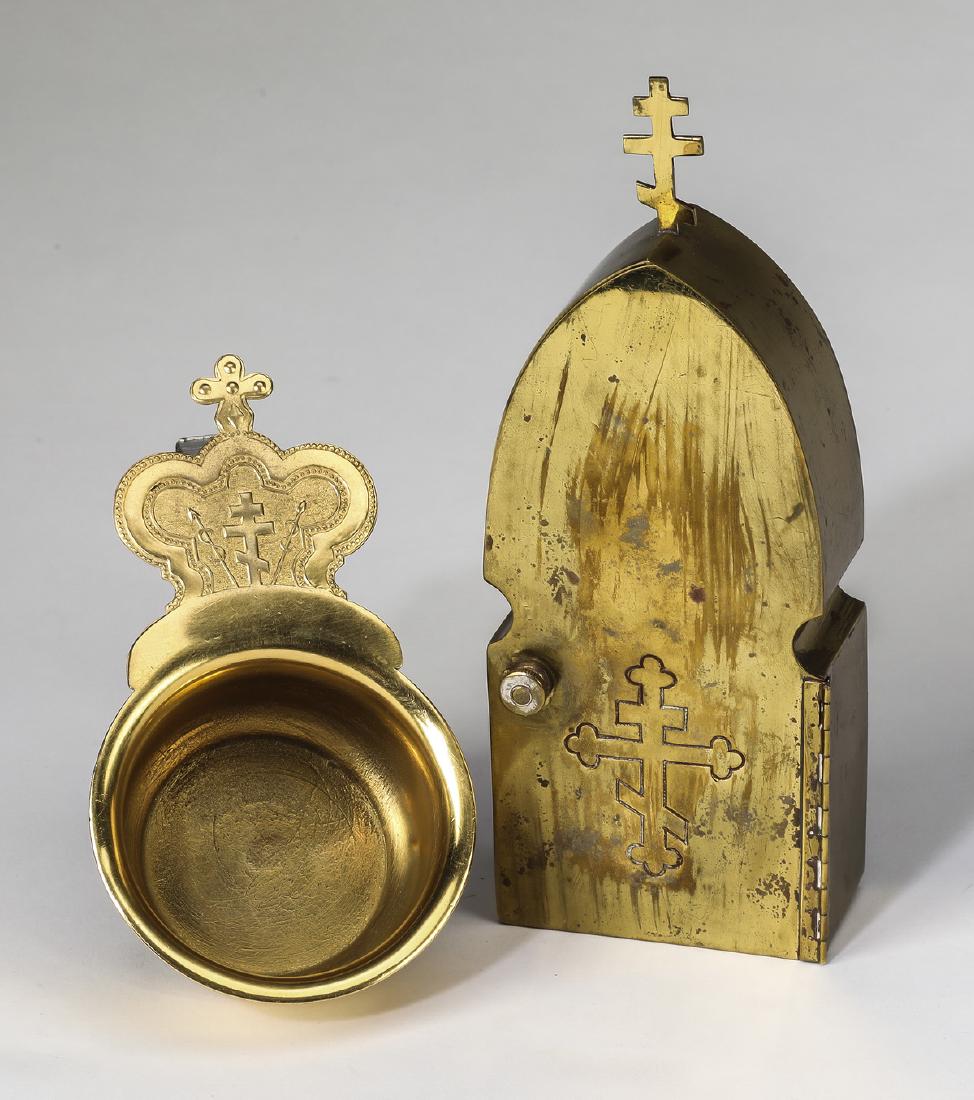 Russian Orthodox traveling tabernacle and Zion cup: Group of Russian Orthodox gilt metal liturgical items, 20th century, including an arch-shaped box used as a traveling tabernacle to carry the Eucharist to the sick, opening to compartments containing 
