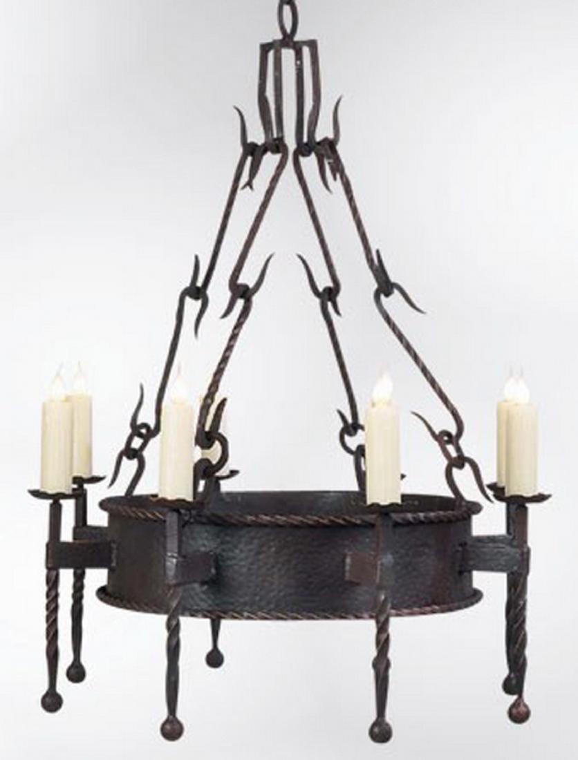 Continental wrought iron Gothic style chandelier: Continental wrought iron Gothic Revival style 8-light chandelier, having 'S' hook linked chains suspending a circular fixture issuing eight torches with faux candles resting on bobeches with twisted s
