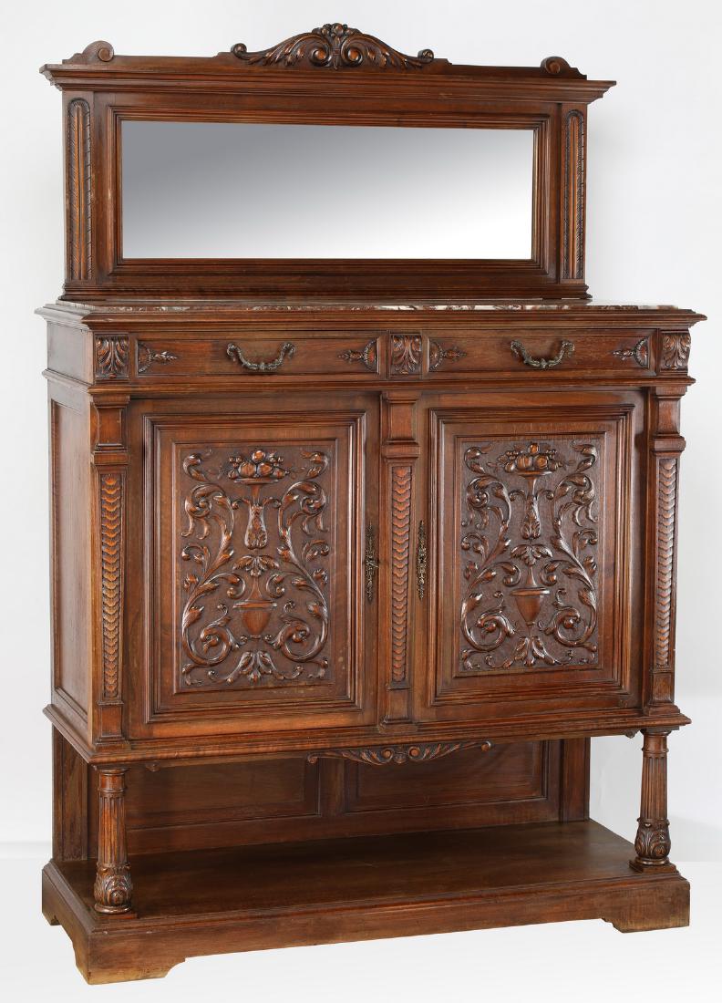 19th c. French carved walnut marble top sideboard: Late 19th century French Provincial walnut sideboard, the mirrored backboard centering an acanthus cartouche and surmounting the two drawer over two door case with marble top, the doors with relief ca