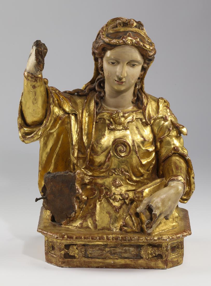 19th c. carved and gold leafed statue of St. Michael: Polychrome and gold leafed statue of the Archangel Michael, 19th century, the half length statue depicts the Archangel wearing a diadem and golden armor while holding one arm in the air, resting on a 