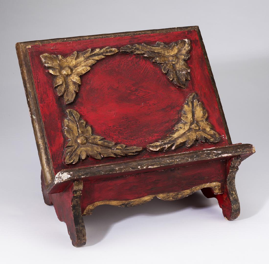 Missal stand, carved and paint decorated: Missal stand, early 20th century, executed in parcel gilt and paint decorated wood, having carved foliate corner ornamentation, 11.5"h x 14"w x 10"d.