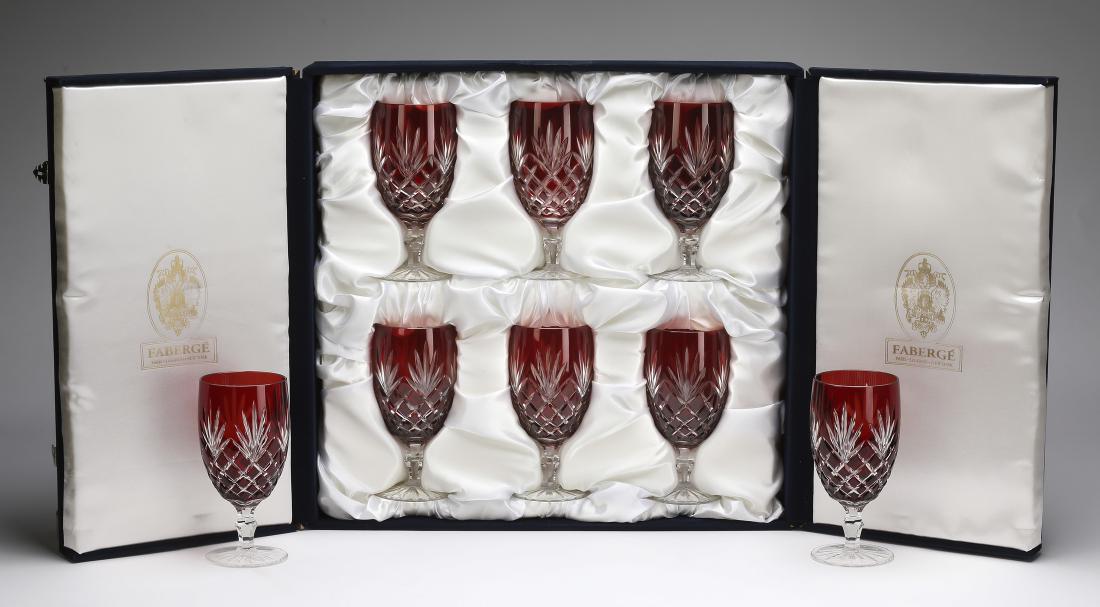 (8) Faberge ruby crystal water goblets w/ fitted case: Set of eight Faberge crystal ruby cut to clear water goblets in the 'Odessa' pattern, maker marked, and having an original fitted case for six glasses, 7"h x 3.30"dia.