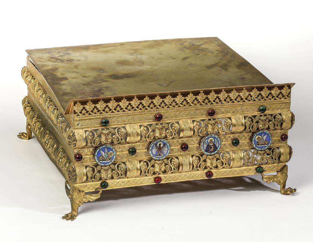 Gilt brass missal stand with four evangelists: Continental gilt brass missal stand, early 20th century, fabricated from multiple strips of pressed and pierced brass forming anthemion, grape clusters, and scrolling foliage, all rising on paw feet,