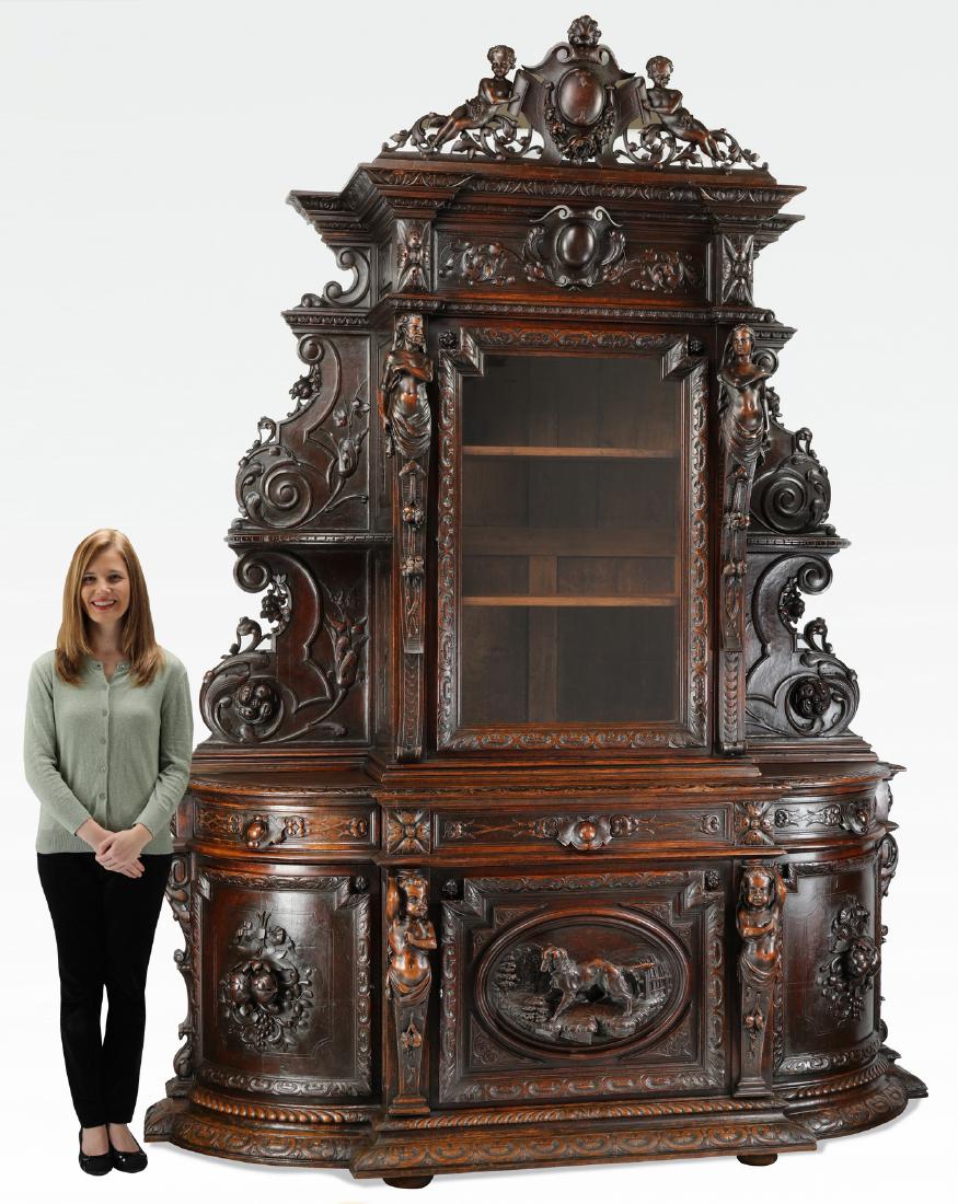 19th c. French carved oak buffet de chasse, 107"h: French carved oak buffet de chasse, late 19th century, having a pierced crest centering a shell topped cabochon flanked by putti and acanthus scrollwork, above a molded cornice and foliate cabochon fr