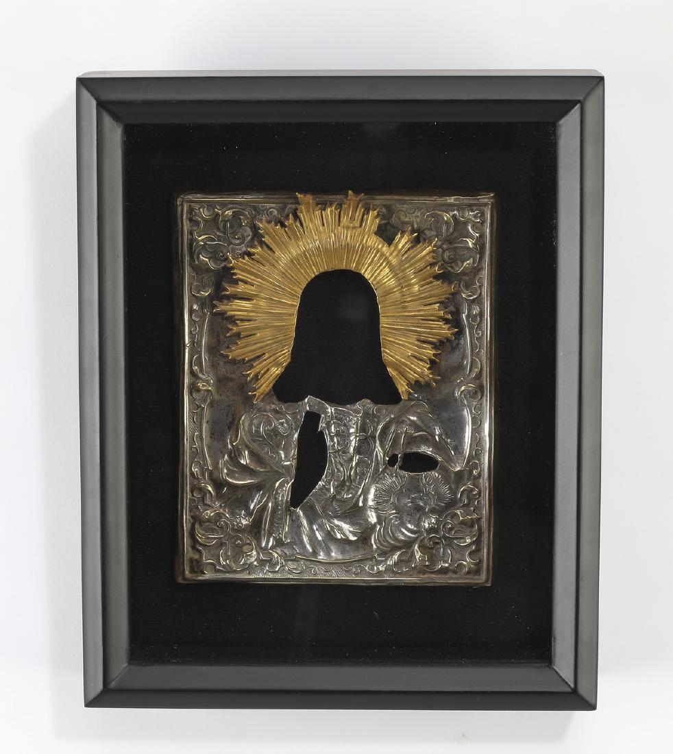 Russian Orthodox silvered and gilt brass riza: Russian Orthodox silvered and gilt brass riza, from an icon of Christ Pantokrator with a gilt sunburst halo, contained in a modern shadow box, 7"h x 5.5"w; overall size with frame 11"h x 9".25"w x 3"d