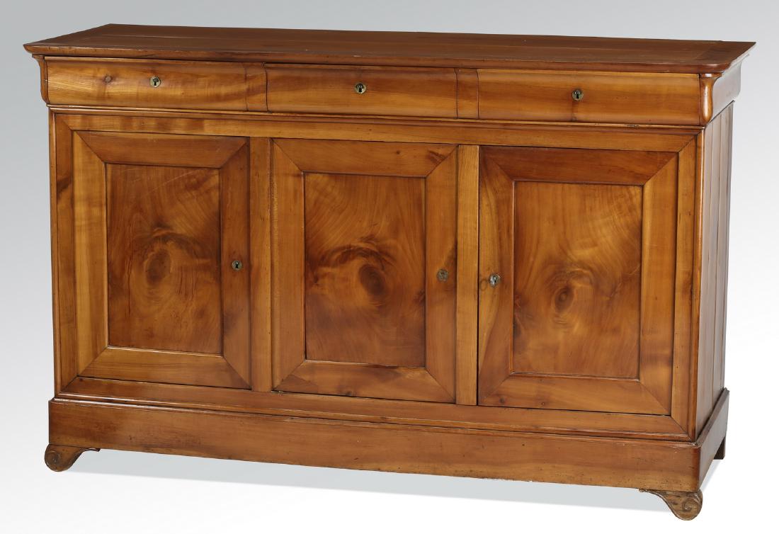 Early 20th c. French Louis-Philippe style buffet: Fruitwood French buffet in the Louis-Philippe style, early 20th century, having a rectangular framed top with rounded corners and edges, over a conforming case with three cove molded frieze drawers su